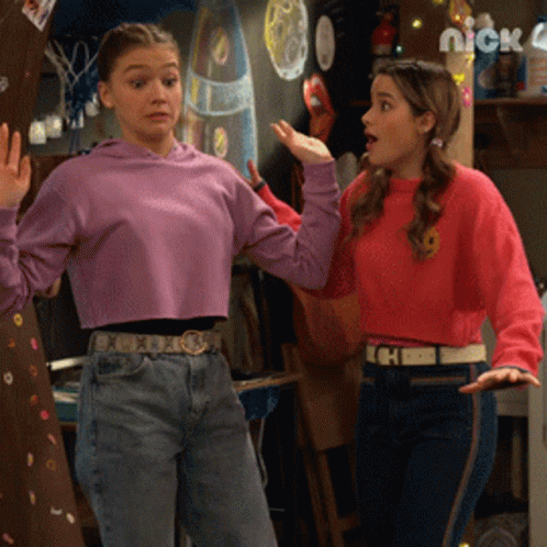 Two Girls Standing Next To Nick 4 GIF