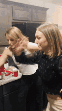 Two Girls Take A Bow GIF