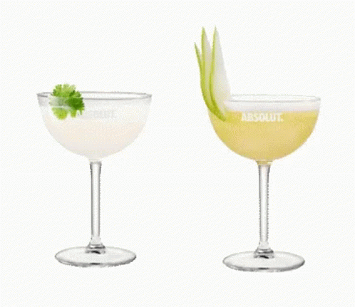 Two Glasses Of Absolut Vodka Are Sitting Next To Each Other On A White Background GIF