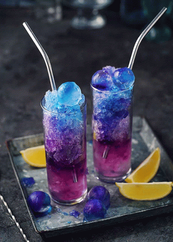 Two Glasses of Purple and Blue Drinks With Straws