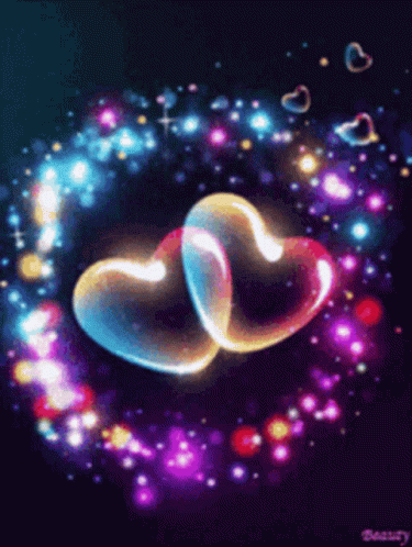 Two Glowing Hearts Are Surrounded By A Circle Of Lights GIF