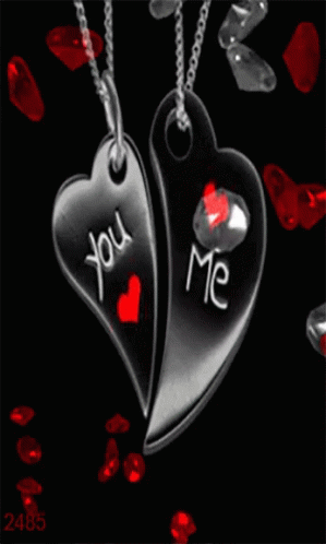 Two Heart Shaped Pendants With The Words You And Me Written On Them GIF
