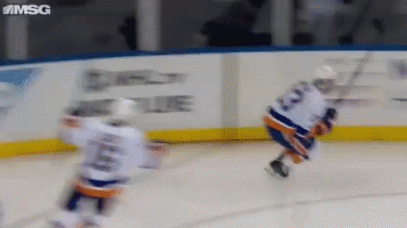 Two Hockey Players on Ice One Number 23