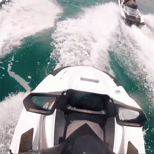 Two Jet Skis Are Going Through The Water And One Has The Word Yamaha On It GIF