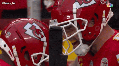 Two KC Football Players Looking At Each Other GIF