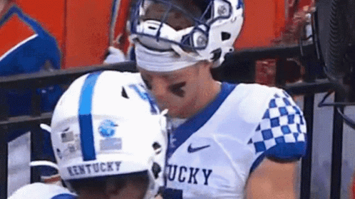 Two Kentucky Football Players Kissing GIF