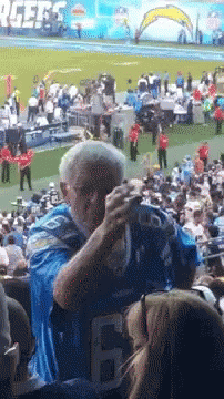 Two Kentucky Football Players Kissing GIF