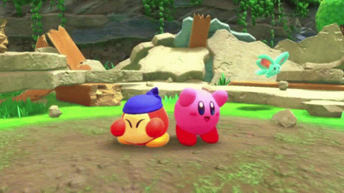 Two Kirbys Are Standing Next To Each Other In A Game GIF
