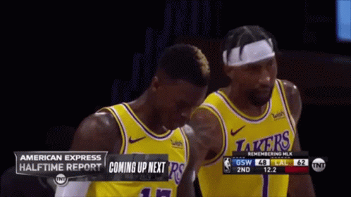 Two Lakers Basketball Players Are Standing Next To Each Other On The Court GIF