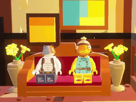 Two Lego Figures Are Sitting On A Couch Next To Each Other GIF