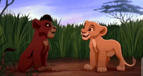 Two Lion Cubs From The Lion King Are Looking At Each Other In A Field . GIF