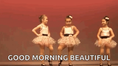 Two Little Girls Are Dancing Together On A Stage And The Words `` Good Morning Beautiful '' Are Above Them . GIF
