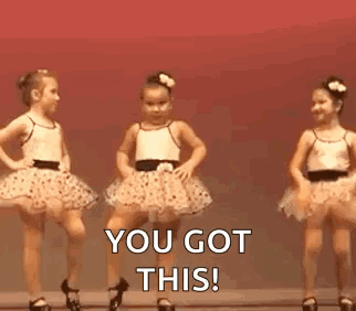 Two Little Girls In Tutus Are Dancing On A Stage . GIF