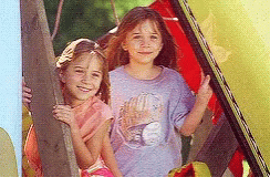 Two Little Girls One Wearing Baseball Shirt