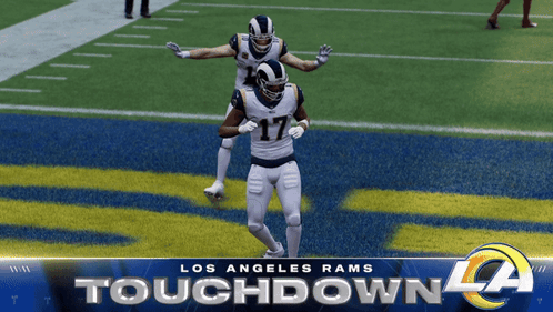 Two Los Angeles Rams Football Players On A Field GIF