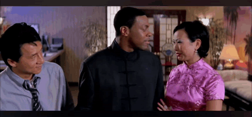 Two Men And A Woman Standing In Living Room GIF