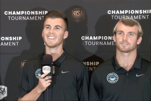 Two Men and Championship Tournament Banner