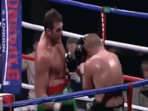 Two Men Are Boxing In A Ring With A Banner In The Background That Says ' Lonsdale London ' . GIF