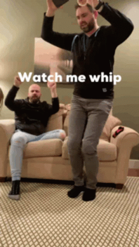 Two Men Are Dancing In A Living Room With The Words Watch Me Whip Written On The Bottom GIF