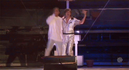 Two Men Are Dancing On A Stage And The Words Ellen Degeneres Are Visible In The Corner GIF