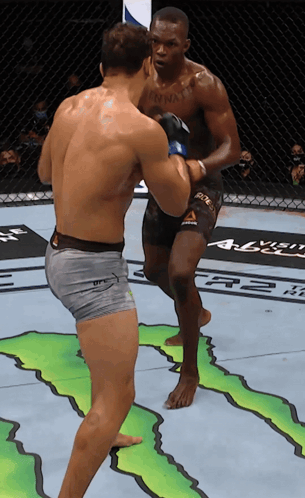 Two Men Are Fighting In A Boxing Ring And One Has A Tattoo On His Chest That Says Anna GIF