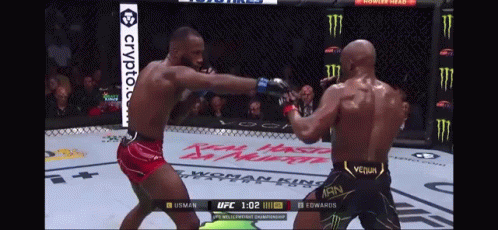 Two Men Are Fighting In A Boxing Ring And One Of Them Is Wearing A Venum Outfit GIF