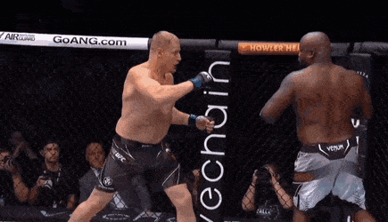 Two Men Are Fighting In A Boxing Ring And One Of Them Is Wearing A Venum Shorts GIF