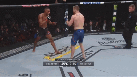 Two Men Are Fighting In A Boxing Ring And The Ufc Lightweight Main Event Is Shown On The Screen GIF