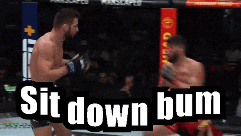 Two Men Are Fighting In A Boxing Ring And The Words Sit Down Bum Are Above Them GIF