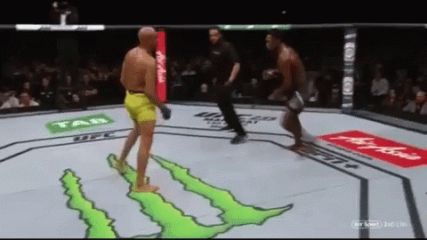 Two Men Are Fighting In A Boxing Ring Sponsored By Monster GIF
