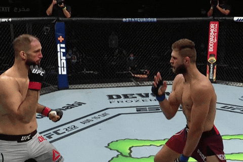 Two Men Are Fighting In A Boxing Ring With A Espn Banner In The Background GIF