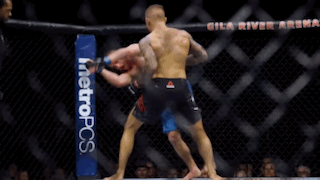 Two Men Are Fighting In A Boxing Ring With A Metropcs Banner On The Side GIF