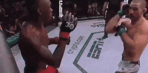 Two Men Are Fighting In A Boxing Ring With Espn Written On The Floor GIF