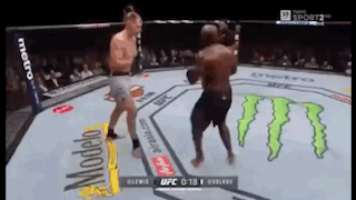 Two Men Are Fighting In A Boxing Ring With Monster On The Floor GIF