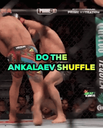 Two Men Are Fighting In A Cage And The Words Do The Ankalaev Shuffle Are On The Screen GIF