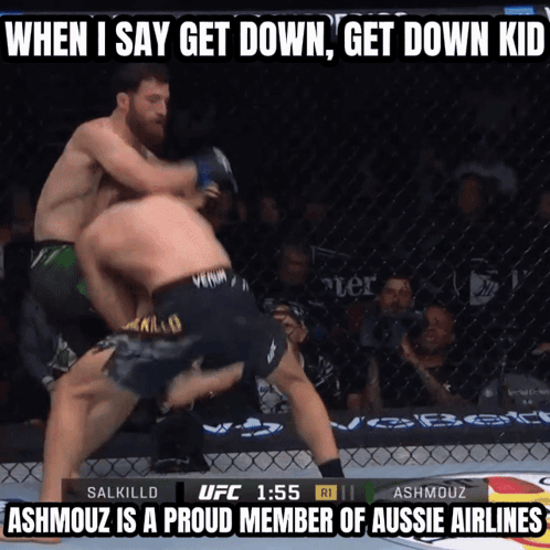 Two Men Are Fighting In A Cage With The Words When I Say Get Down Get Down Kid At The Top GIF