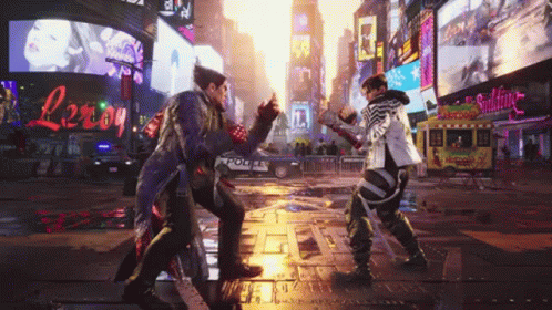 Two Men Are Fighting In A City Street With A Police Car In The Background GIF