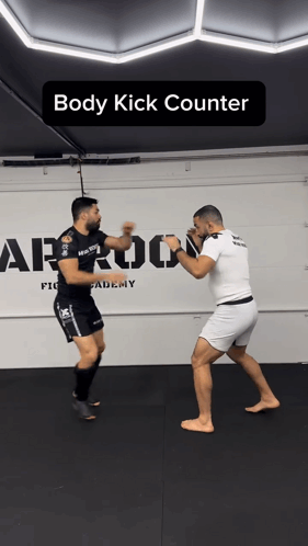 Two Men Are Fighting In A Gym With The Words Body Kick Counter On The Bottom GIF