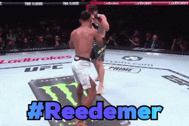 Two Men Are Fighting In A Ufc Ring And The Hashtag #Reedemer Is Displayed GIF