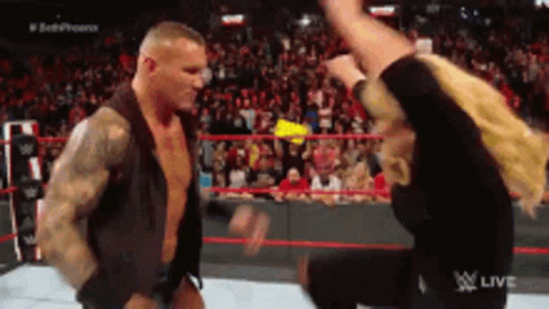 Two Men Are Fighting In A Wrestling Ring With The Word Live On The Bottom Right GIF