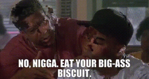 two men are fighting over a biscuit and one of them is covered in icing .