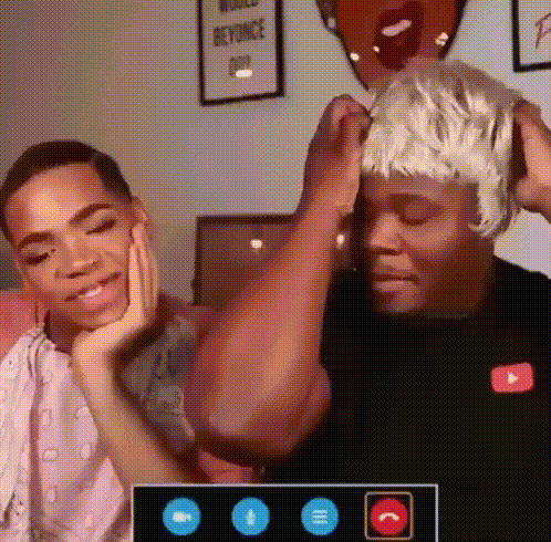 Two Men Are Having A Video Call And One Of Them Is Wearing A Wig GIF