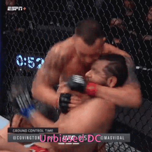 Two Men Are Hugging In A Cage With The Words Ground Control Time On The Screen GIF