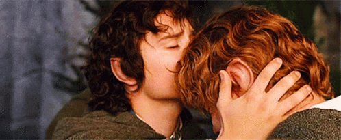 Two Men Are Kissing Each Other In A Movie Scene . GIF