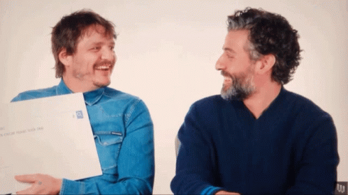 Two Men Are Laughing And One Is Holding A Piece Of Paper That Says ' I Love You ' GIF
