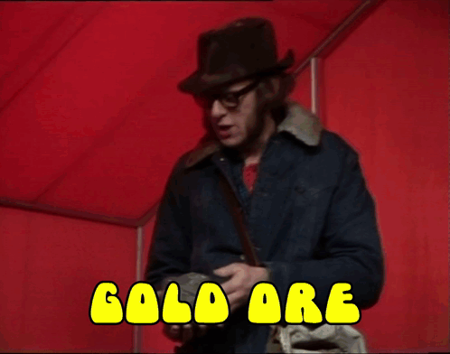 Two Men Are Laying On A Bed With The Words Ore Written In Yellow GIF