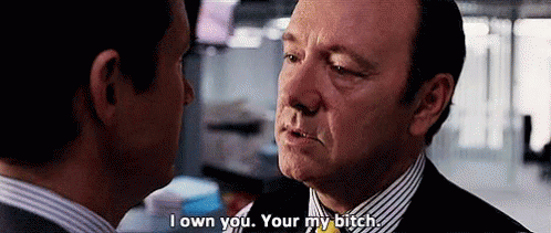 Two Men Are Looking At Each Other And One Of Them Is Saying `` I Own You . Your My Bitch '' . GIF