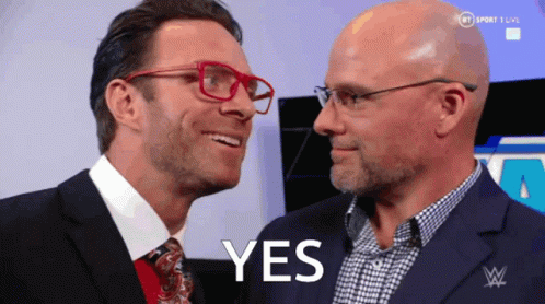 Two Men Are Looking At Each Other And The Word Yes Is On The Screen GIF