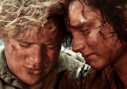 Two Men Are Looking At Each Other With Tears Coming Out Of Their Eyes GIF