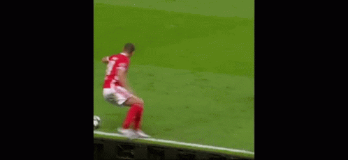 Two Men Are Playing Soccer On A Field And One Of Them Is Wearing A Number 21 Jersey . GIF